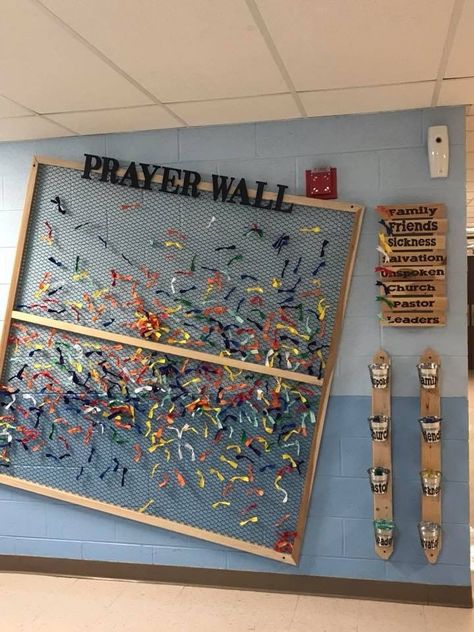 Use a space on your walls to put up a prayer wall like this. Using fabric scraps, tissue paper, or anything lightweight and flexible and give each color a topic of prayer request. Encourage the youth to go each service and pray over some of the colors, maybe even recruit a few who want a way to serve to go and pray over them and help reset the board every couple weeks. High School Ministry Room, Youth Group Wall Art, Kids Prayer Wall, Prayer Wall For Kids, Verse Of The Week Board Diy, Answered Prayers Board, Christian Prayer Room Design Ideas, Youth Art Projects, Youth Decorations Church