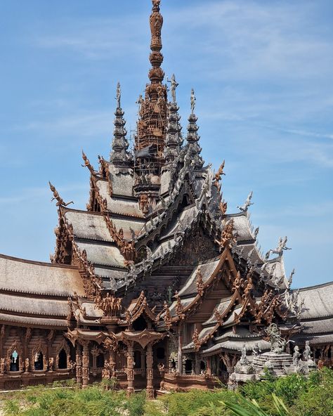 Thailand's remarkable Sanctuary of Truth Museum: ALL wood and NO nails! Towering over the shores of Pattaya, this Thai temple is a marvel of intricate wooden architecture that left us completely awestruck. This unfinished museum, the brainchild of Thai businessman Lek Viriyaphan, is a unique blend of temple and castle, inspired by Ayutthaya Kingdom, Buddhist, and Hindu philosophies. The Sanctuary's construction began in 1981, and despite being unfinished, it has become an iconic landmark of ... Thai Temple Architecture, Sanctuary Of Truth, Thailand Architecture, Thailand Temple, Thai Architecture, Thailand Country, Temple Thailand, Thai Temple, Thailand Art