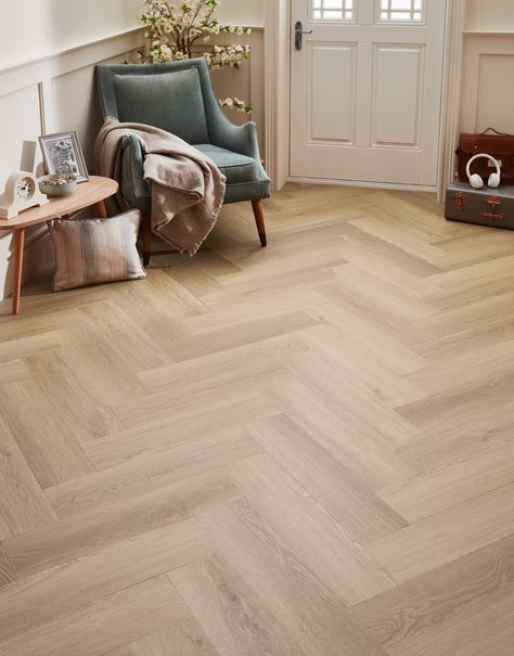 Discover the charm and resilience of Asenso Royal Herringbone, the perfect flooring choice for those who desire both beauty and practicality. Asenso Royal Herringbone offers the timeless look of natural wood. It’s waterproof, scratch-resistant, and incredibly easy to maintain, making it the perfect choice for busy households. With a wide range of stunning designs you can effortlessly enhance any room in your home. To complete your purchase and ensure a hard-wearing finish, we recommend usin Hallway Ideas Flooring, Herringbone Flooring Bedroom, Herringbone Floor Living Room Modern, Natural Oak Herringbone Floor, Floor Colour Ideas, Herringbone Hybrid Flooring, Oak Herringbone Floor Hallway, Herringbone Bedroom Floor, Herringbone Floor Entryway