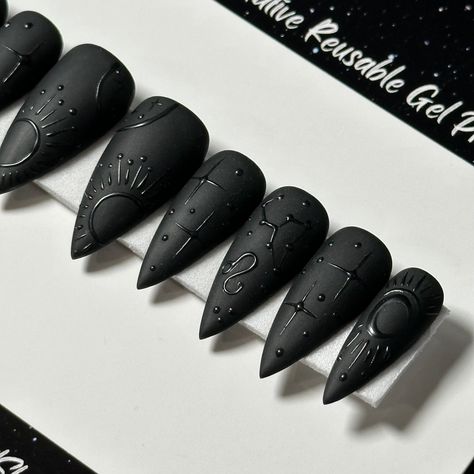 Welcome to LD Nails! 🖤 One set of 10 REUSABLE Press On Nails 🖤 🖤 Made to order in your shape & size 🖤 🖤 Black on Black: Zodiac. Velvet Matte black press on nails with glossy black zodiac detailing ♌️ ♊️ Leo & Gemini are pictured, Please leave a note with your sign in the personalization box, so I can customize it just for you! 🖤 Purchase INCLUDES an application kit! It consists of: 🖤 detailed application & removal instructions 🖤 a sealed and sanitary mani kit (100/180 file, buffer block, Matte Black Skeleton Nails, Punk Press On Nails, Shiny On Matte Nails, Zodiac Nails Designs Leo, Black Nails Press On, Black Gold Manicure, Celestial Black Nails, Matte Black Witchy Nails, Planchette Nail Art