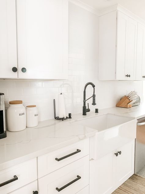 Small White Kitchen Black Hardware, Black Kitchen Fixtures White Cabinets, White Kitchen Dark Hardware, White Cabinets Black Fixtures, White Farmhouse Sink Black Faucet, White Kit Hen Cabinets Black Hardware, White Sink With Black Faucet, White Cabnits With Black Handles, White Kitchen Matte Black Hardware