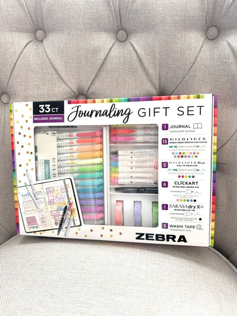 Enhance your artistic abilities with this exquisite Zebra Journaling Gift Set. Perfect for beginners and professionals alike, this set features an assortment of non-toxic art markers in assorted colors. The set includes a range of high-quality Zebra pens, ideal for drawing, lettering, and coloring. This journaling gift set is a perfect addition to your art supplies and is suitable for an array of crafting needs. Whether you are an artist or looking to take up a new hobby, this set is sure to impress. We offer fast and free shipping to ensure that your package arrives quickly. Take your art to the next level with this Zebra Journaling Gift Set. 1 Hardcover Journal and 1 Sarasa Dry Gel Pen 15 Mildliner Markers 5 Milder Brush Pens 5 Washi Tapes 6 CLiCKART Marker Pens Zebra Journaling Kit Feat Zebra Brush Pens, Note Taking Pens And Markers, Best Pens For Journaling, Clickart Pens, Stationary Gift Ideas, Art Supplies Aesthetic, Sketchbook School, Zebra Pens, Toxic Art