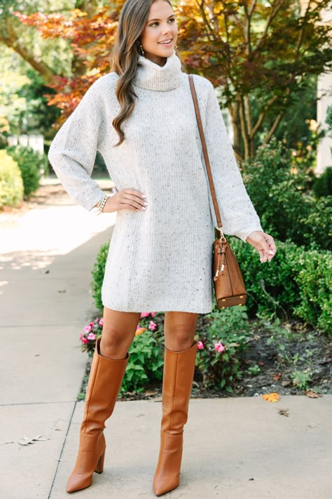 We are really feeling this sweater dress! That confetti knit fabric is so cozy and warm! Not to mention that turtleneck is sure to keep nice and toasty! This sweater dress is going to look fabulous with tall boots for fall or winter! Cozy turtleneck Long dolman sleeves Confetti knit fabric Generous stretch Sydney is wearing the small. Fall Turtleneck Dress, Winter Dress And Coat, Dress And Tall Boots Outfit, Ivory Sweater Dress Outfit, Boots With Sweater Dress, How To Wear Dresses In Winter, Fall Sweater Dress Outfits, Winter Dresses Outfit, Dress With Boots Winter