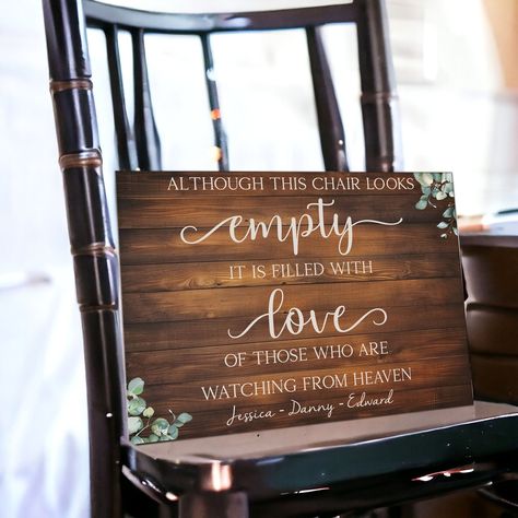 Honor the memory of loved ones at your wedding with our Personalized Reserved In Loving Memory Wedding Sign. Crafted from durable 3mm MDF with a dark rustic wood effect, this sign serves as a heartfelt tribute to those celebrating from Heaven. Perfect for sitting on a chair at your wedding ceremony or reception, it reminds everyone that though their seats may be empty, they are filled with love. Personalize the sign with the names of departed loved ones, creating a touching memorial that honors In Memory Chair At Wedding, Dark Rustic Wedding Decor, Seats For Passed Loved Ones Wedding, Wedding Memorial Table Ideas Display, Seat For Loved One In Heaven Wedding, Memorial Chair At Wedding, Chair Reserved For Someone In Heaven, Wedding Signs For Loved Ones Who Passed, Reserved For Those In Heaven Wedding