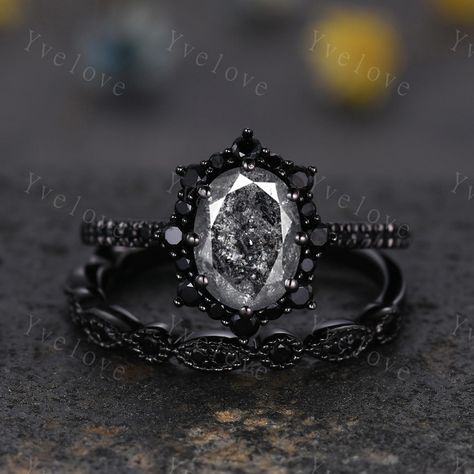 Gothic Oval Shape Salt and Pepper Diamond Engagement Ring Set,Black Gold Diamond Promise Ring Unique Rhodium Black Witchy Ring Bridal Gift,Anniversary Ring Gift For Her,moissanite band ,antique ring set for women Material: Solid gold (10k 14k 18k rose gold,yellow gold,white gold,Platinum available) Main stone:6x8mm oval Cut natural Salt and Pepper Diamond(Every stone will be unique and vary!) Side stone:with black spinel halo and wedding band  0.25ct round cut real diamonds Band width:approx 1.8 Gothic Wedding Rings His And Hers, Rose Gold Black Diamond Ring Engagement, All Black Engagement Ring, Black Rings For Women Engagement, Black Silver Engagement Ring, Rose Gold And Black Engagement Ring, Vintage Gothic Wedding Rings, Gothic Wedding Rings Set, Gothic Engagement Ring Victorian