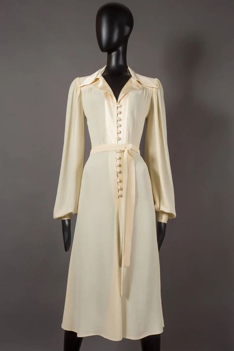 Ossie Clark ivory moss crepe collared evening dress with satin trim, circa 1974 For Sale at 1stDibs | ossie clark dresses, ossie clark clothes 1970s Wrap Dress, Bishop Sleeve Dress, Ossie Clark, 20th Century Fashion, Satin Evening Dresses, 1970s Dresses, Iconic Dresses, Royal Outfits, 60 Fashion