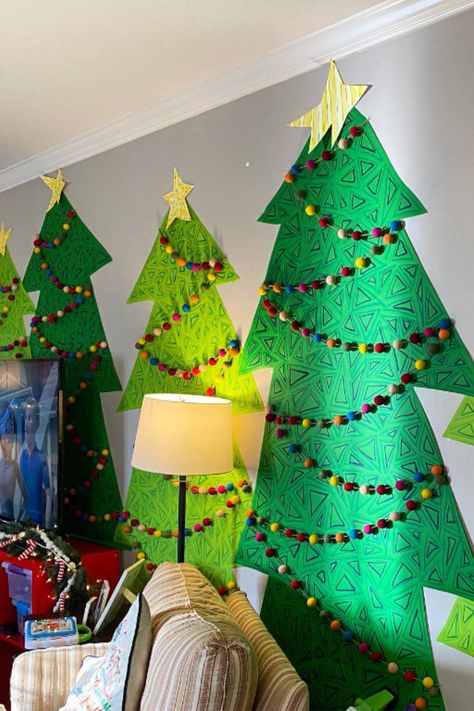 Paint large pieces of paper into Christmas trees and hang up for a homemade holiday decoration! 🎄 Large Cardboard Christmas Tree, Large Paper Christmas Tree, Paper Christmas Tree Diy, Christmas Tree Diy, Large Christmas Tree, Virtual School, Christmas Tree Crafts, Paper Christmas Tree, Homemade Holiday