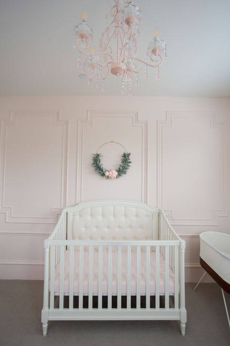 Intimate White (BM) pale blush pink painted accent wall with millwork in a beautiful nursery - StylishPetite. #intimatewhite #blushpink Painted Accent Wall, Intimate White, Blush Pink Paint, Pink Accent Walls, Best Bedroom Paint Colors, Origami White, Pink Paint Colors, Shoji White, Dream Nurseries