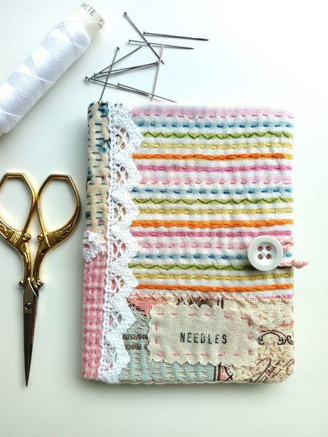 Completely hand stitched, this colourful little needle book will brighten up your workspace and store your sewing needles away beautifully.  A selection of pretty fabrics have been put together, then stitched with hundreds of individually embroidered stitches, to add texture. I've also added little pieces of cotton lace trim for contrast.  A hand stamped 'NEEDLES' label is also stitched to the front, so that you know what's inside.   Easily wrap the hand braided cord around the double button fas Fabric Shops Online, Fabric Book Covers, Sewing Essentials, Crazy Patchwork, Needle Cases, Sewing Needles, Needle Book, Needle Case, Sewing Book