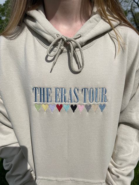 Perfect trendy crewneck for The Eras Tour🌙✨ 💕Hoodies come in white, sand, ash, light pink, and navy SLEEVE PERSONALIZATION IS AN ADDITIONAL ADD ON, and is not included when purchasing this listing. Add it to your cart when purchasing to include this personalization.  AGAIN, sleeve is not included when purchasing this product.  All clothing and accessories from 88Evergreen are handmade-to-order, just for you! 😊 These are made to order so they will take some time- Please consider this when orde Embroidery Taylor Swift Shirt, Eras Tour Embroidery, Eras Tour Hoodie, Taylor Merch, Taylor Swift Merchandise, Personalized Clothing, Trendy Crewneck, Taylor Swift Shirts, Taylor Swift Tour Outfits