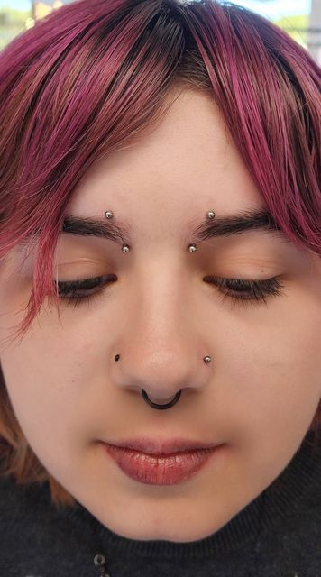 Baron Art Piercing Studio on Instagram: "Bridge piercings are one of the most turned down piercings.  You have to have enough tissue to hold the barbell without the tissue being manipulated a certain type of way.  Bridge piercings are also done with a straight barbell. Curved barbells are not acceptable and can cause more scarring and a "cheese cuttet" effect.  This is a great alternative to a bridge. You would need to have the right anatomy for it and be diligent with aftercare to ensure a happy, long-lasting piercing. As with any piercings, you still run the risk of migration or rejection of snagged hard.  Piercer: @piercing.mistress  . . . #pairedinnereyebrowpiercing #piercing #nostril #orangepiercer #innereyebrowpiercing #eyebrowpiercing #nostril #piercingvideo #explorepage" High Bridge Piercing, Triple Bridge Piercing, Eyebrow Piercing Placement Chart, Eyebrow Piercing And Glasses, Inner Eyebrow Piercing, Bridge And Septum Piercing, Small Bridge Piercing, Vertical Bridge Piercing, Double Bridge Piercing