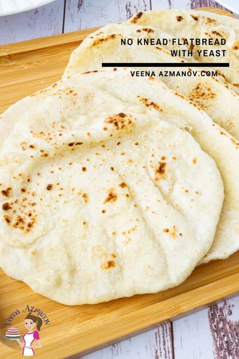 This flatbread recipe uses six ingredients including yeast and needs only 30 minutes to rise. You don't need to knead it and yet it produces a soft, tender flatbread that's perfect for wraps and spreads as well as with BBQs and grills such as shawarma or hummus. #flatbread #flatbreadrecipe #bread #flatbread #breadrecipes #nokneadflatbread