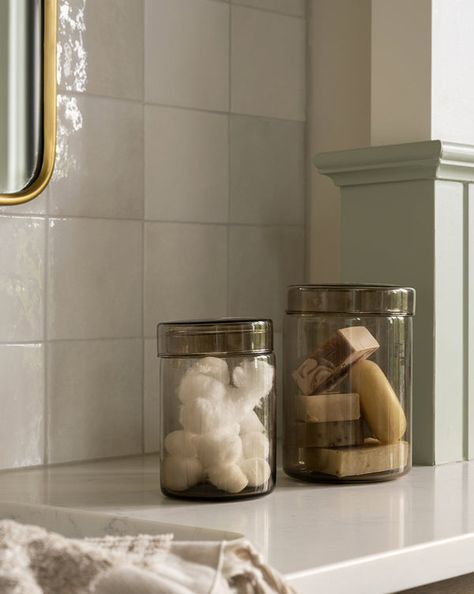 Glass Canisters Bathroom, Bathroom Canister Ideas, What To Put In Glass Jars, Canister Decor, Organic Modern Bathroom, Bathroom Canisters, Mcgee And Co, Bathroom Counter Decor, Bathroom Decor Sets