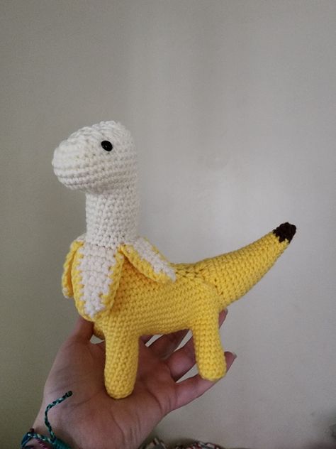 This is a handmade by myself crochet banana dinosaur. This silly guy is the perfect companion for anyone, and a fantastic talk piece! Have a good laugh and great times with this guy! He is handmade in the USA and all materials are US made as well. ❤️ Crochet Animals Dinosaur, Bananasaurus Crochet Pattern, Banana Dinosaur Crochet, Guy Crochet Gifts, Fun Things To Crochet Simple, Bananasaurus Crochet, Crochet Gifts For Guys, Cute Crochet Stuffed Animals, Cute Things To Crochet For Boyfriend