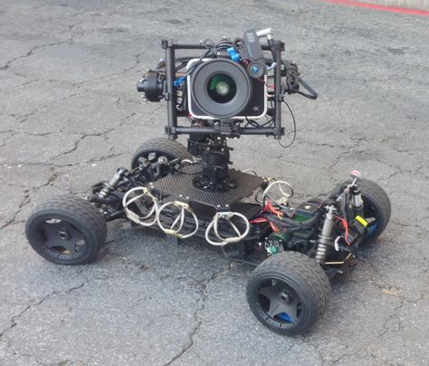 Cine Gear Expo 2014 Update - One-Off RC car with shock stabilized camera platform rigged with a Blackmagic Cinema Camera on a motorized remote turret.  #movingpicture #cinegearexpo Camera Grips, Blackmagic Cinema Camera, Outdoor Roller Skates, Radio Control Diy, Camera Gimbal, Camera Techniques, Small Drones, Rc Buggy, Radio Controlled Boats