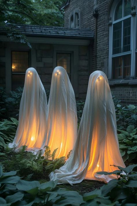 15 Spooky DIY Halloween Decorations You Must See 16 Halloween Yard Ghost Decorations, Ghost Decoration Outdoor, Ghosts Hanging From Tree Diy, Diy Lumiere Candlestick Costume, Witchy Outdoor Decor Halloween, Budget Outdoor Halloween Decorations, Haunted Porch Ideas Diy, Spooky Halloween House Exterior, Scary Halloween House Decoration