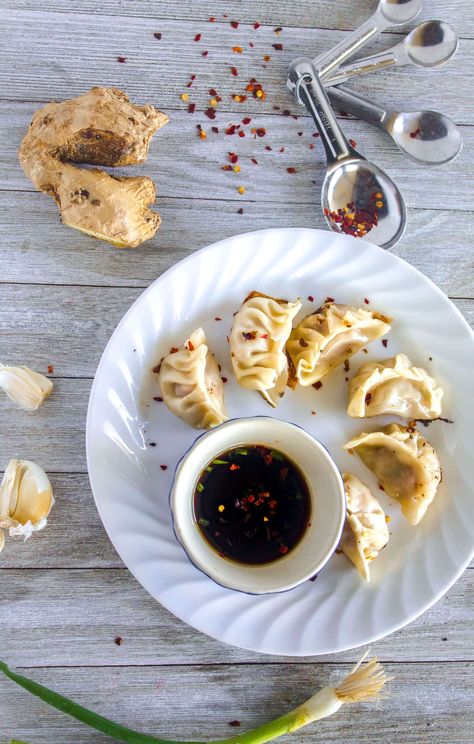 Gyoza, pork dumplings, pot stickers, what ever you call them, they're an Asian take-out staple made easily and deliciously at home, filled with ginger, garlic, and fragrant sesame oil then steamed and fried. Grab a partner, grab some pork, and get to pleating, you'll never need that Chinese take-out menu again. Pork Potstickers, Pork Dumplings, Take Out Menu, Pork Dumpling, Pot Stickers, What Ever, Sesame Oil, Sweet Tea, Yummy Appetizers