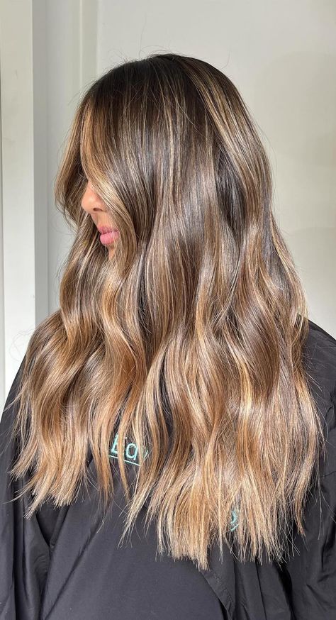 Book your refresh in today! #brondebalayage #blondehairwithdarkroots #brondelivedinhair #balayagehair #brondehaircolourideas #haircolourideas #brunettehairhighlights #softbronde #ashybronde #sunkissedhair #warmbalayage Bronde Balayage Caramel, Brown Hair Colors Dark Roots, Honey Brown Hair With Dark Roots, Golden Bayalage On Dark Hair, Lightning Brown Hair, Full Head Balayage Brunettes, Bronde Caramel Balayage, Brown Balayage Asian Hair, Summer Balayage Brunette To Blonde