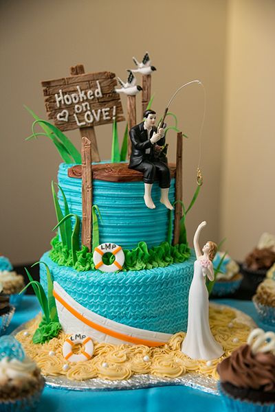 Build your theme around a favorite location or hobby, like this beach and fishing-themed celebration held near a marina with gorgeous sunset views. Rehearsal Dinner Fun, Fishing Wedding Cakes, Groomsman Cake, Fishing Themed Wedding, Grooms Table, Beach Cake, Fishing Wedding, Beach Cakes, Wedding Beach