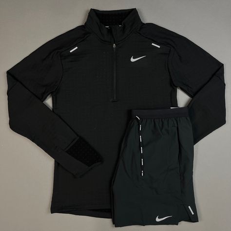 Image: The Nike Therma-Fit Repel Element 1/2 Zip Shirt is a long sleeved top for men. The Nike Therma-Fit top is made of soft material that repels water and keeps you warm. The top has a half-long zip that allows you to manage ventilation levels. Thumb holes in the sleeves ensure extra coverage and warmth. Nike Wear, Matching Tracksuit, Adidas Wallpapers, Running Hoodie, Half Zip Top, Zip Shirt, Nike Long Sleeve, Track Suit, Long Sleeved Top