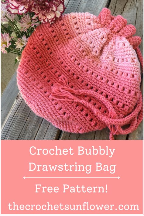 This pretty, pink drawstring bag is perfect for road trips, or days at the beach. Get the free crochet pattern here! thecrochetsunflower.com Drawstring Crochet Bag Pattern Free, Crochet Drawstring Bag Pattern Free, Drawstring Crochet Bag, Drawstring Crochet, Crochet Puff Stitch, Bag Free Crochet Pattern, Chunky Yarn Crochet, Bag Free Pattern, Crochet Drawstring Bag