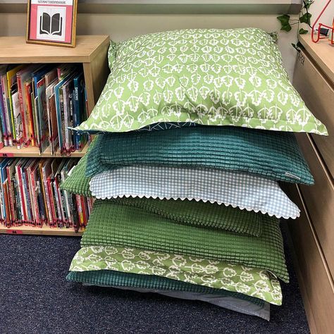 Pillows for dayyyys! These are perfect for low tables. Classroom decor, classroom design, natural classroom, classroom organization, nature themed classroom, calming classroom decor, flexible seating Classroom Theme Nature, Nature Themed Library, Nature Aesthetic Classroom, Elementary Classroom Themes Nature, Granola Classroom, Cottagecore Classroom Theme, Whimsigoth Classroom, Nature Based Classroom Decor, Nature Preschool Classroom Decor