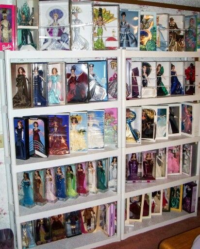 Karen Holshouser's collection Barbie Display Ideas Shelves, Barbie Collection Display Ideas, Barbie Doll Display Ideas, Barbie Shelves, Barbie Collection Display, Barbie Display Ideas, Barbie Stand, Barbie Display, Toy Collection Room