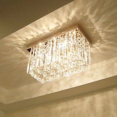 Light reflection of the crystals makes the space to be romantic. Jhoomer For Living Room, Chandler Lights, Cheap Ceiling Lights, Metal Living Room, Rectangular Chandelier, Flush Mount Chandelier, Crystal Chandelier Lighting, Modern Crystal Chandelier, Diy Ceiling