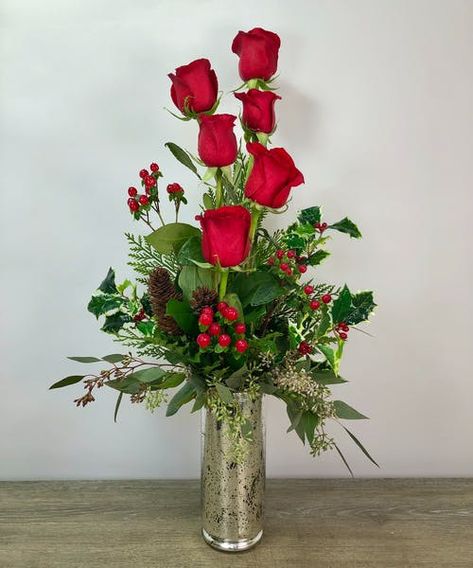 If you can't go home for the holidays, send your love with the Christmas Rose arrangement! Half a dozen long stem red roses with seasonal greenery in our beautiful keepsake mercury glass container. #GeorgesFlowers Dozen Roses Arrangement, Rosé Christmas, Dozen Roses, Hosting Holidays, Roanoke Va, Flowers Arrangements, Holiday Flower, Holiday Floral, Rose Arrangements