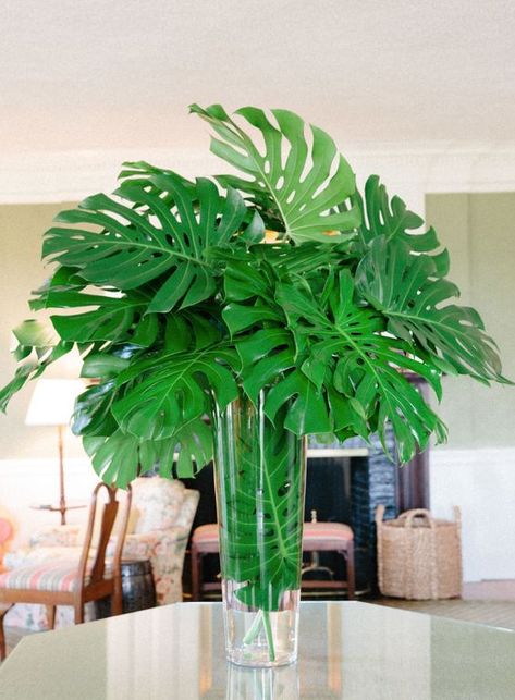 a lush tropical leaf wedding centerpiece is a chic idea for any tropical wedding Palm Leaf Centerpiece, 21 Nails, Tropical Wedding Ideas, Tropical Centerpieces, Foliage Arrangements, Tropical Floral Arrangements, Tropical Flower Arrangements, Tropical Architecture, Tropical Home Decor