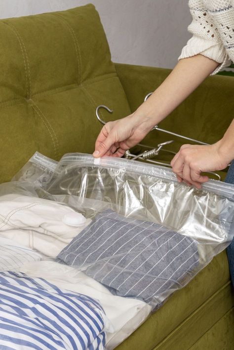 woman packing her seasonal clothes and using vacuum space bag to stay organized Chalkboard Vinyl, Kids Toy Store, Space Bags, Organization Station, Clean Space, Door Organizer, Old Computers, Be Honest With Yourself, Organizing Tips