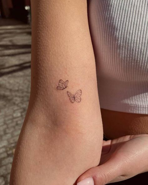 Butterflies Small Tattoo, Subtle Tattoos For Couples, Dainty Butterfly Tattoo Wrist, Cute Butterflies Tattoos, Friendship Tattoo Butterfly, Very Small Butterfly Tattoo, Two Tiny Butterfly Tattoo, Butterfly Arms Tattoos, Single Needle Tattoo Butterfly