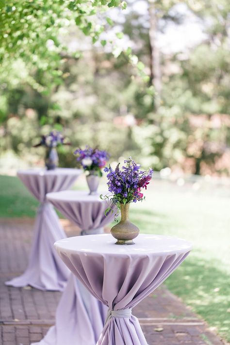 #cocktail-table  Photography: We Heart Photography - www.weheartphotography.com  Read More: http://www.stylemepretty.com/2014/11/21/bright-magenta-vineyard-wedding/ Wedding Cocktail Hour Florals, Bride And Groom Table Purple, Lavendar Table Settings, Lavender Table Setting Wedding, Lavender Sweetheart Table, Purple Garden Party, Purple Table Settings, Wedding Cocktail Tables, Purple Wedding Tables