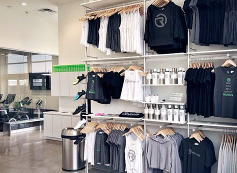 Modern Retail Display Fixtures & Sign Displays - UDIZINE Retail Wall Display Ideas Clothing, Fitness Studio Retail Display, Sweatshirt Display Retail, Retail Apparel Display Ideas, Yoga Merchandise Display, Retail Display Fixtures, Retail Display Clothing, Merch Wall Display, Yoga Studio Retail Display