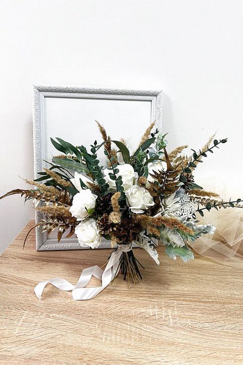 That seasonal bouquet could be elegant for your big day. In my opinion, that enhances any winter ceremony. Collect this inspiration to your winter wedding inspiration. Pampas Wedding Bouquet, Bridal Bouquet Greenery, Wedding Bouquet Pampas, Bridal Bouquet Winter, Wedding Bouquet Winter, Greenery Bridal Bouquet, Wedding Flowers Boho, Bouquet Greenery, Winter Ceremony