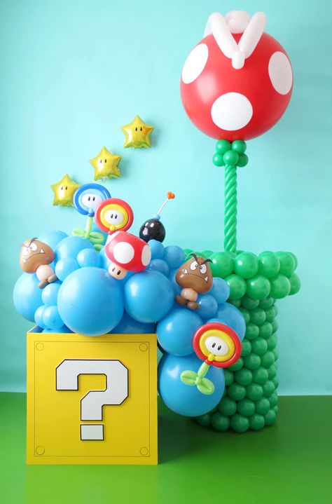 Super Mario Balloons Coming Out of Coin Box with Super Mario Themed Balloon Characters Super Mario Balloon Backdrop, Mario Balloon Backdrop, Bowser Balloon Arch, Mario Balloon Decor, Super Mario Balloon Decor, Mario Brothers Balloon Decorations, Super Mario Bros Balloons, Mario Bro Balloon Garland, Mario Brothers Balloon Arch