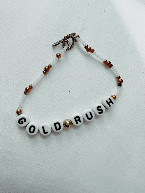 Gold rush beaded friendship bracelet Gold Rush Taylor Swift Bracelet, Gold Rush Bracelet, All To Well Bracelet, Friendship Bracelets Taylor Swift Ideas, Tswift Bracelets, Evermore Friendship Bracelet, Evermore Bracelet, Eras Friendship Bracelet, Friendship Bracelets Taylor Swift