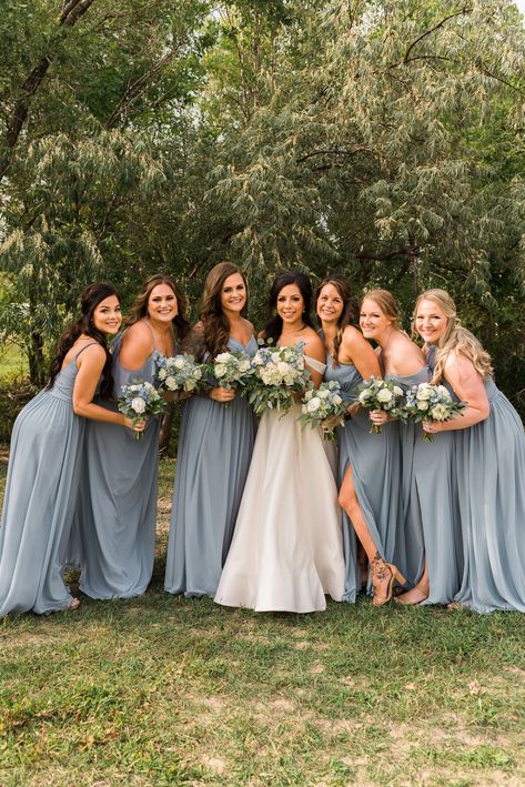 Dusty Blue Bridesmaid Dress Photos with the bride. Bridesmaid bouquets with dusty blue and white flowers. #dustybluewedding #dustybluebridesmaiddresses #FortCollinsWedding Bridesmaid Dress Blue Dusty, Dudty Blue Bridesmaids Dresses, Dusty Blue Dress Bridesmaid, Dusty Blue Chiffon Bridesmaid Dress, Duty Blue Bridesmaid Dresses, Dusty Blue Bridesmaid Dresses Fall, Stormy Blue Bridesmaid Dress, Blue Bridesmaid Dresses Dusty Blue, Powder Blue Wedding Theme Bridesmaid Dresses