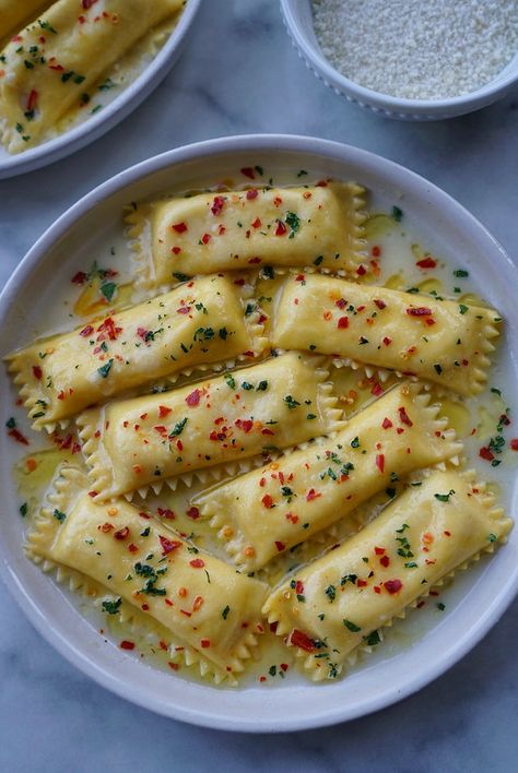 Roasted Garlic & Whipped Ricotta Agnolotti in a parmigiano butter sauce with crushed red chili flakes Chili Garlic Pasta, Chili Oil Garlic Butter Pasta, Filled Pasta Recipes, Italian Food Appetizers, Pasta Filling, Pasta Table, Semolina Flour, Garlic Confit, Whipped Ricotta