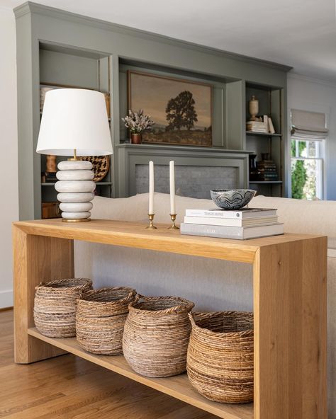 We’re still raving about this color palette — the combination of the neutral and light sofa, muted green built-ins, and the natural wood tones throughout the room makes for such a calm and inviting space. Design: @cohesivelycurated Photo: @caskro Styling: @cozbi_jean #cohesivelycurated #seattleinteriors #bellevueinteriors #interiordesign #seattleinteriordesigner #fireplacedesign #livingroomdesign #homestyling #finditstyleit #consoletable #homedecor #voguehome #mydomaine Vogue Home, Light Sofa, Muted Green, Wood Tones, Fireplace Design, Luxury Interior Design, Built Ins, The Natural, Space Design