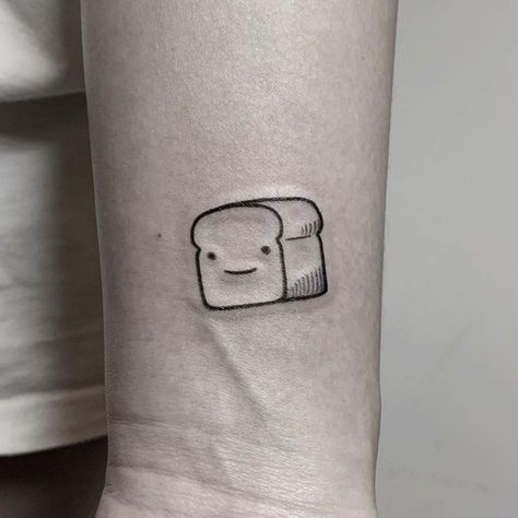 A super cute Bread Pitt tattoo inked on a wrist by @hellotako Bread Tattoo Small, Small Food Tattoos, Lil Tattoo, Bread Tattoo, Lil Tattoos, Culinary Tattoos, How To Tattoo, Dbz Tattoo, Cute Bread