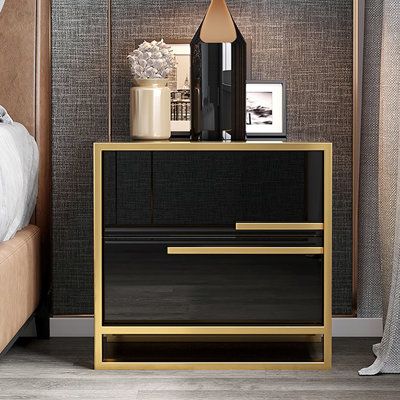 The contemporary nightstand, which is alive with modern beauty and a fashion design, adds a touch of luxury to any bedroom. The color combination which includes a black surface and gold base, seems sumptuous and handsome, keeping with its high quality. This contemporary nightstand will provide a fresh look to your bedroom. This nightstand has a high gloss paint surface that is simple to maintain and clean and provides you with an exquisite fashion appearance. Therefore, it is an excellent choice Black And Copper Bedroom, Cream And Gold Bedroom, Nightstand Minimalist, Black Gold Bedroom, Gold Nightstand, Copper Bedroom, Minimalist Nightstand, Gold Bedroom Decor, Metal Nightstand