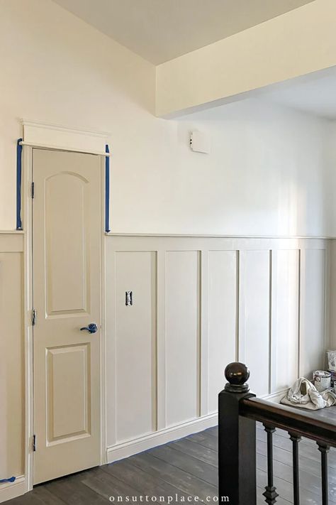 Adding board and batten walls, plus extra millwork around the doors, gives this plain foyer a much-needed update. Board And Batten Foyer, Adding Board And Batten, Board And Batten Hallway, Small Foyer Ideas, Batten Walls, Small Foyer, Batten Wall, Board Batten, Board And Batten Wall