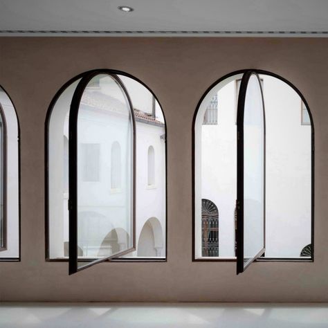 Black steel framed windows with arched heads Arch Window Interior, What To Do With Arched Windows, Arched Steel Windows, Modern Arch Window, Modern Arched Windows, Arch Windows Exterior, Arched Windows Exterior, Arch Window Design, Window Arches