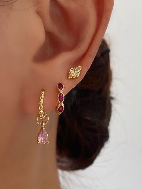 This gorgeous set comes with • 1 pair of Pink CZ dangle earrings with 15mm (or 12mm princess hoops)- Material: 18K gold plated on 925 sterling silver, AAAAA Cubic Zirconia • 1 pair of Pink Marquise hoops - Material: 18K gold plated on Brass, Cubic Zirconia • 1 pair of Gold stud earrings - Material: 8K gold plated on 925 sterling silver, AAAAA Cubic Zirconia • 1 Anett Gift Box HypoallergenicNickel free and Lead free Earring Set Aesthetic, Pink And Gold Earring Stack, Pink Princess Makeup Looks, Gold And Pink Earrings, 3 Ear Piercings, Pretty Ear Piercings, Princess Earrings, Colored Earrings, Pretty Jewelry Necklaces