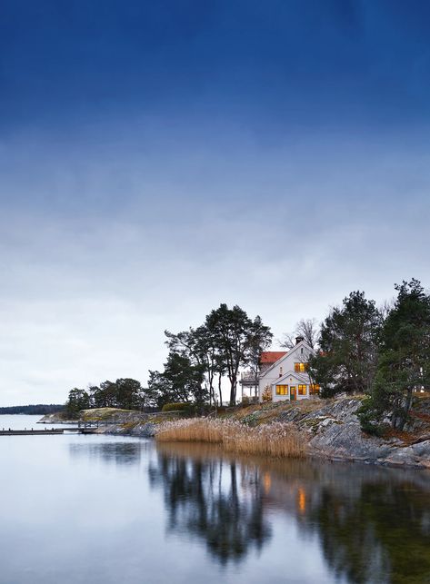 An interior designer's peaceful Christmas retreat on the Stockholm archipelago | House & Garden Wooden Dining Table Rustic, Peaceful Christmas, Stockholm Archipelago, Mews House, Concrete Fireplace, Modern Stairs, Vacation House, San Francesco, Christmas Decorations For The Home