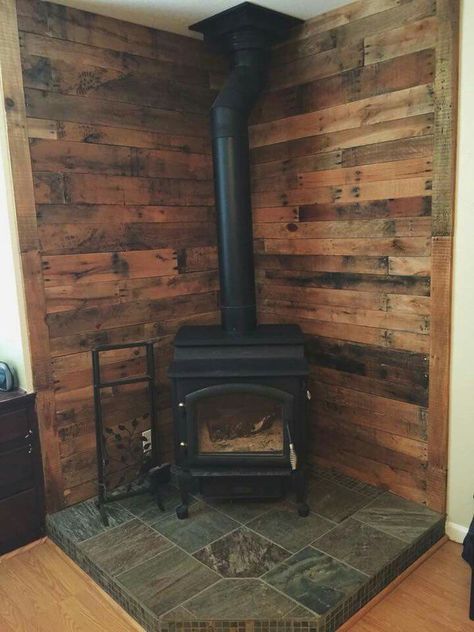 We have a corner wood stove so I'm just trying to think of ideas for it...Nick wants to tear it out though. We'll see. Corner Wood Stove, Wood Stove Surround, Woodburning Stove Fireplace, Wood Stove Hearth, Pallet Walls, Wood Stove Fireplace, Pellet Stove, Corner Fireplace, Pallet Wall