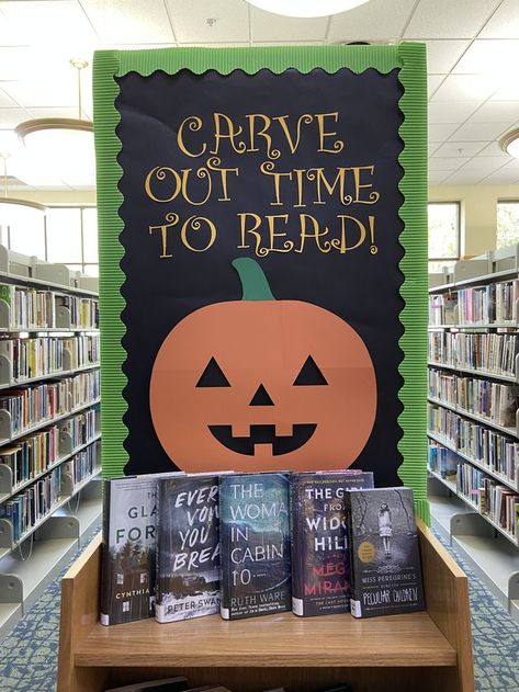 Carve Out Time For Reading, October Bulletin Board Ideas For Library, Halloween Book Fair Ideas, High School Library Book Display Ideas, Welcome Back To School Library Displays, Space Library Display, Library Trunk Or Treat Ideas, Halloween Displays Library, Halloween Library Bulletin Board Ideas