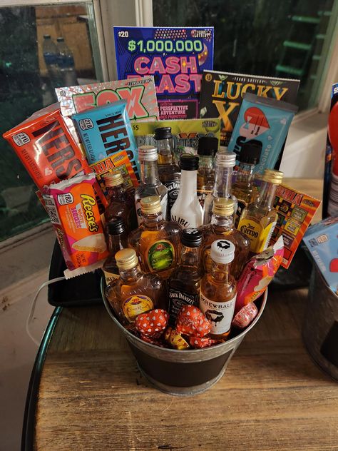 A super large bouquet of liquor, lottery tickets and candy. The perfect gift for valentines day, father's day or any other special occasion! Lotto Basket Ideas, Creative Gift Baskets For Men, Scratcher Bouquet Lottery Tickets, Jack And Jill Raffle Basket Ideas, Lottery Gift Basket, Husband Gift Basket, Lottery Ticket Gift Ideas, Adult Gift Basket, Lottery Ticket Bouquet