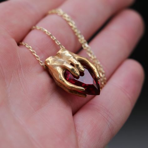 Gold Plated Garnet Hand 925K Silver Pendant, 925 Silver Gold Plated Garnet Design Pendant, Silver Garnet Necklace, Garnet Silver, Gold Ruby Necklace Sizes Height: 25 mm Width: 18 mm Thickness: 11 mm, at the widest part Weight: about 16-18 grams. (Including chain) - Center Stone : Emerald, Blue Topaz, Sapphire, Amethyst, Garnet - Carat: 12-18mm --->Materials: - 925 Silver, Gold Plated, Rose Gold Plated --->Items are shown larger in pictures to show detail - please note the dimensions. This item i Fantasy Earrings, Snake Jewelry, Topaz Necklace, Snake Earrings, Garnet Necklace, Dope Jewelry, Charm Necklaces, Jewelry Lookbook, Funky Jewelry